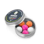 Silver metal tin with lid open and six foam strike balls in orange, pink, white