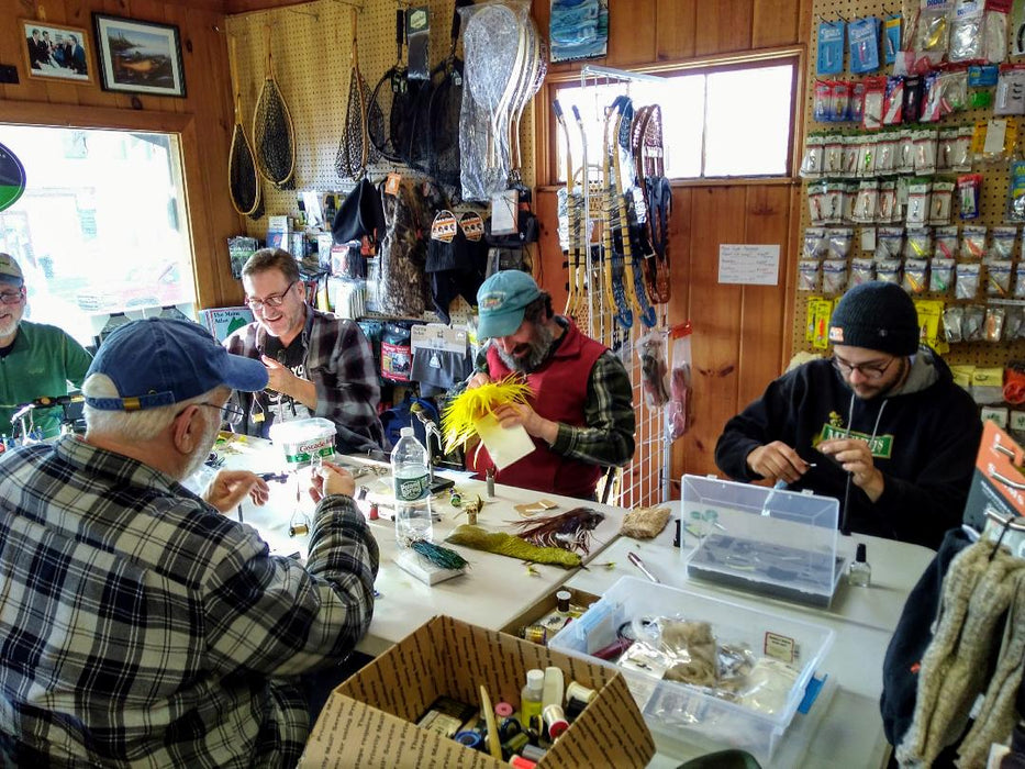 Five People tying flies at the Rangeley Region Sport Shop