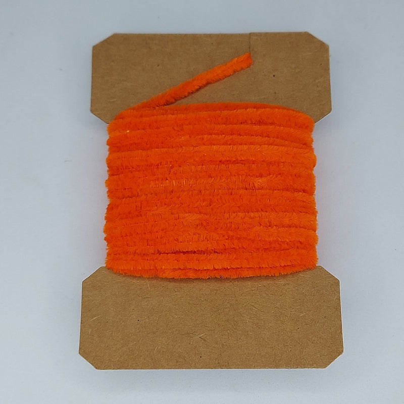 Medium rayon chenille yarn spool in orange with ribbed fuzzy texture
