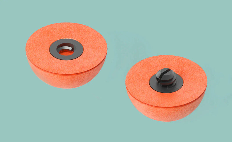 Orange foam strike indicators with black bases and central holes