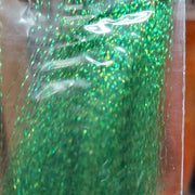 Green iridescent sparkly tinsel fibers with holographic glitter
