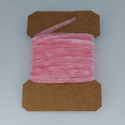 Medium rayon chenille yarn spool in pink with ribbed fuzzy texture