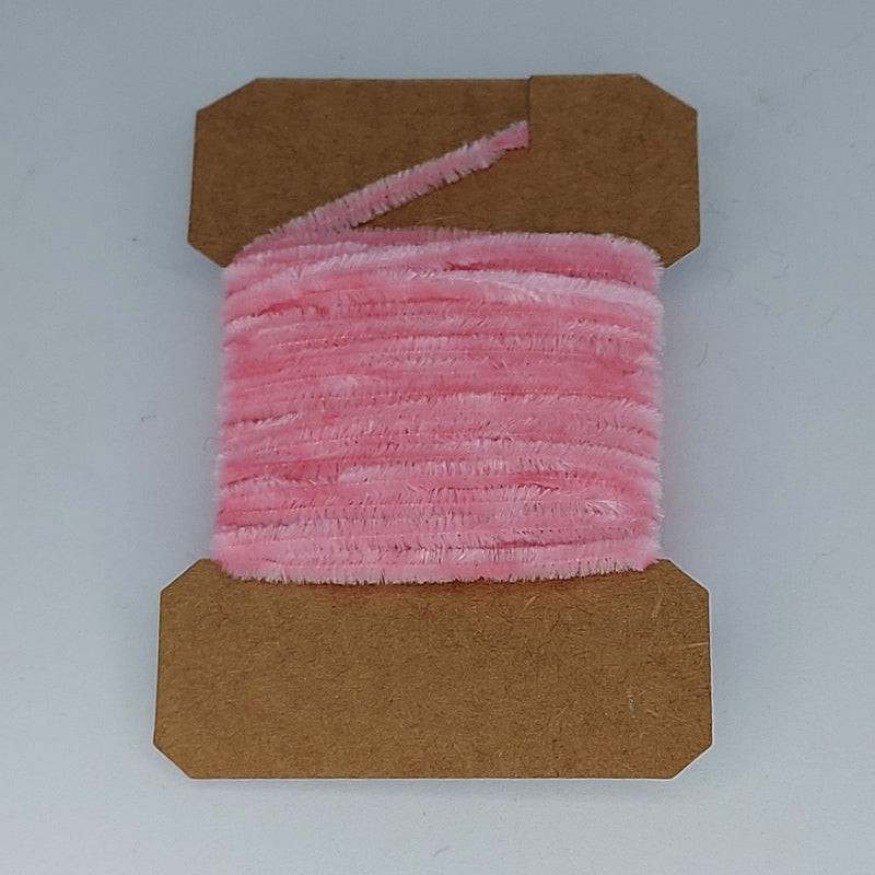 Medium rayon chenille yarn spool in pink with ribbed fuzzy texture