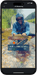 A photo of a phone on which the user uploaded a fish picture to the Flytechy app and received his fish's length, girth, and weight.