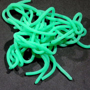 Single plastic worm toy, bright green, tangled in a pile.