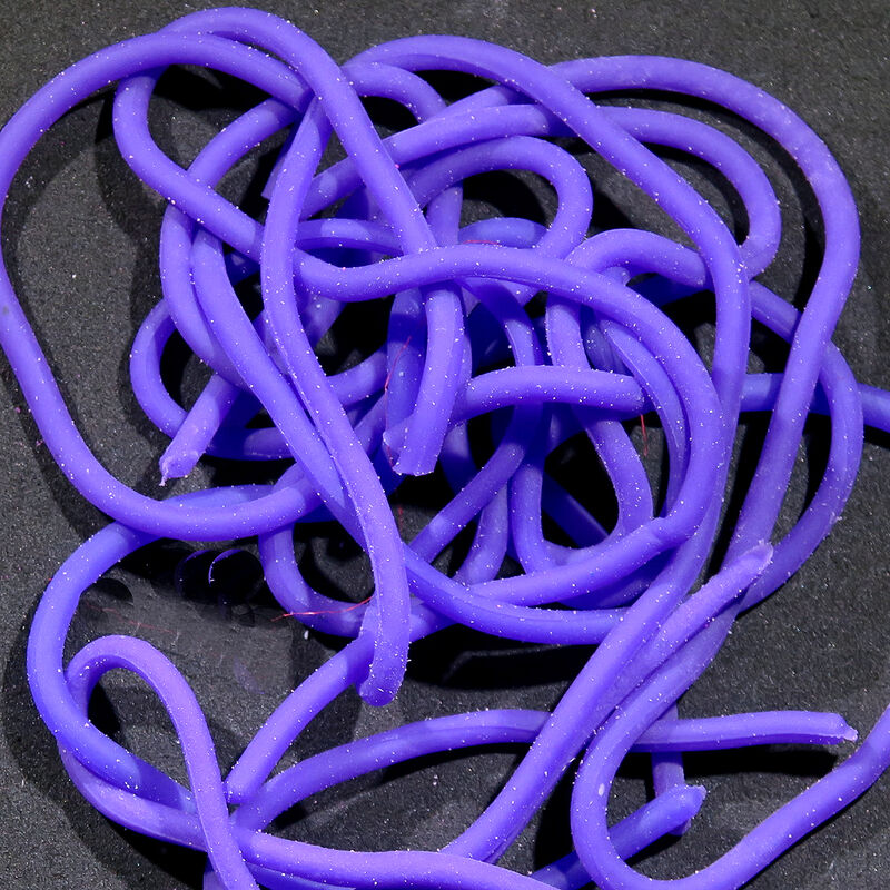 Single plastic worm toy, purple, tangled in a pile.