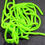 Single plastic worm toy, neon green, tangled in a pile.