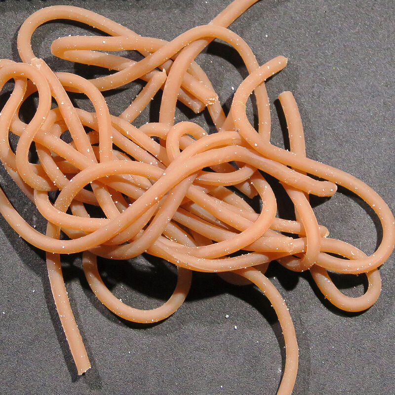 Single plastic worm toy, light brown, tangled in a pile.