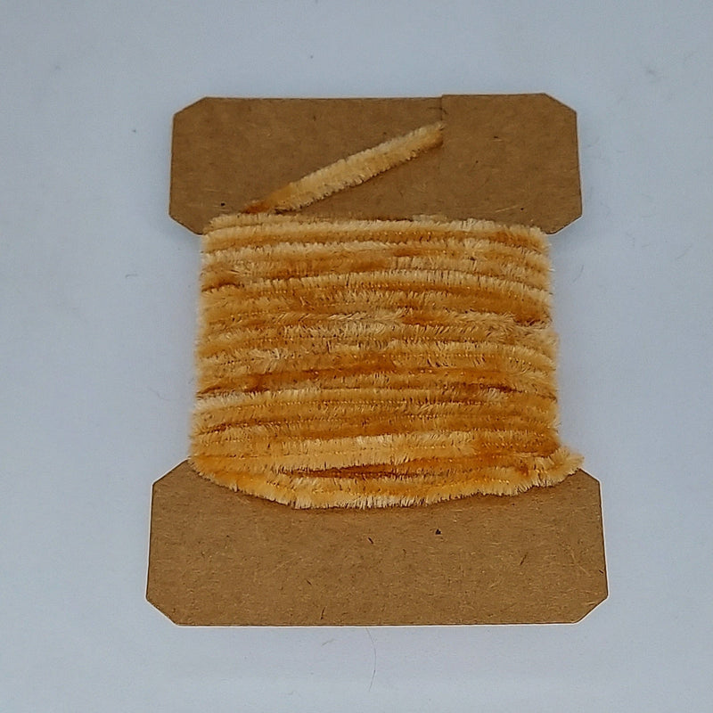 Medium rayon chenille yarn spool in tan with ribbed fuzzy texture