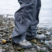 Dark blue waterproof pants with gathered hem and cuffs over water shoes