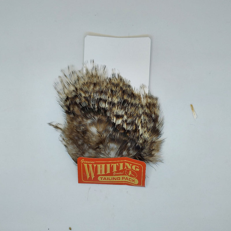 Whiting tailing pack with tan, brown, and black mixed feather fibers