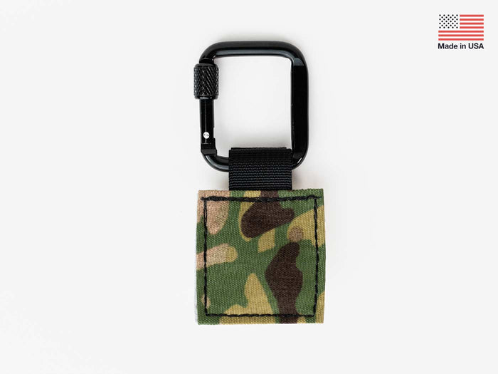 Fly patch on keychain carabiner, green camouflage with stitched border and Velcro
