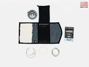 Foldable stash bag with black exterior, open top, white interior lining and rings