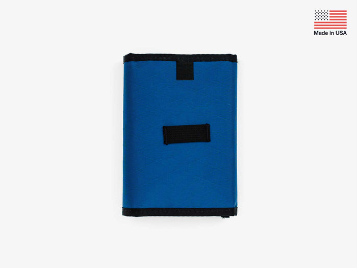 Foldable stash bag in blue with stitched black back tab and top edge
