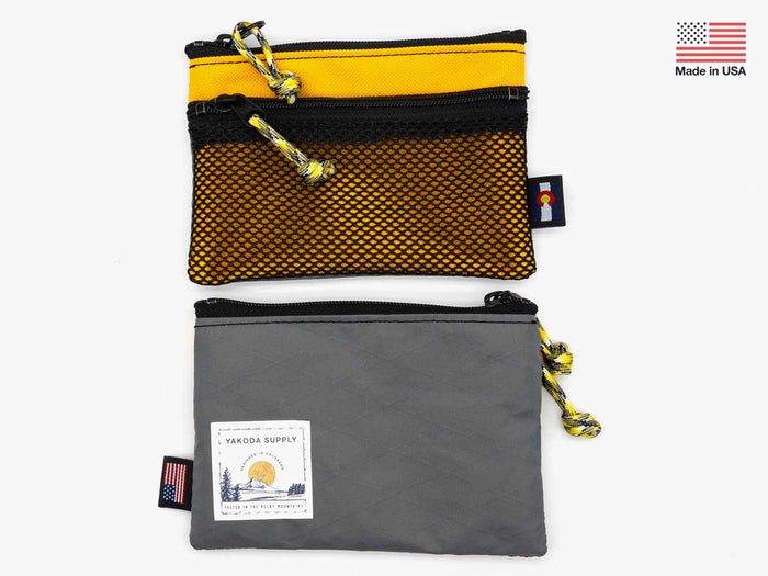Yakoda utility wallet with yellow top panel, black mesh, two zippers, gray base pouch