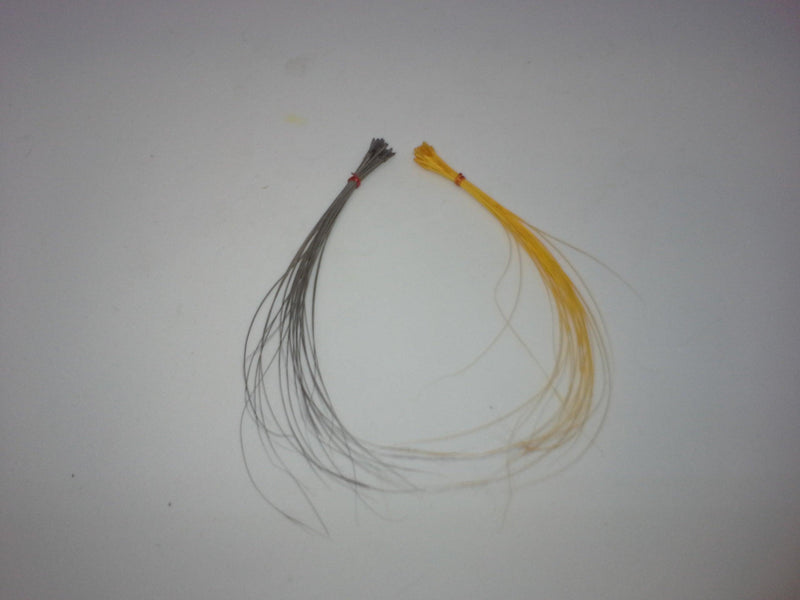 Quill body fly with gray and brown feather fibers, looped bundle