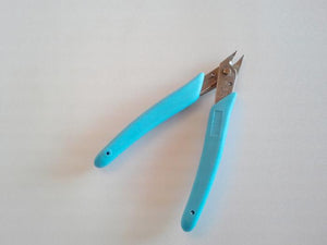 blue handled pliers with line cutter excellent for bending barbs on fly fishing flies