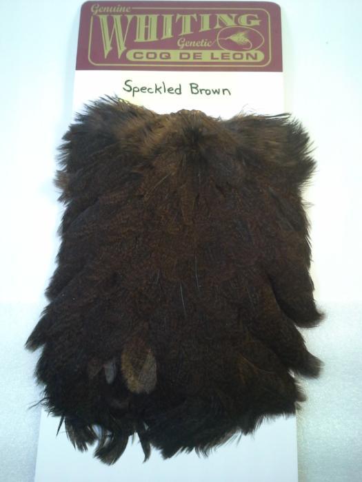 Speckled brown hen saddle feather patch with dark, fluffy texture
