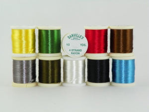 variety of colors of shiny 4 strand floss used for tying bodies of streamer flies from Rangeley maine fly shop