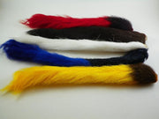 Assorted calftail/kiptail tails with red, black, blue, and yellow fibers