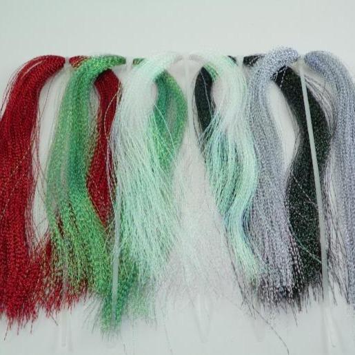 Sparkly tinsel fibers bundle in red, green, and blue with silver highlights
