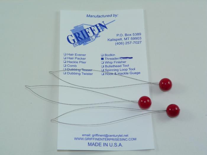 Bead threader set with three metal needles and red glass beads on packaging card