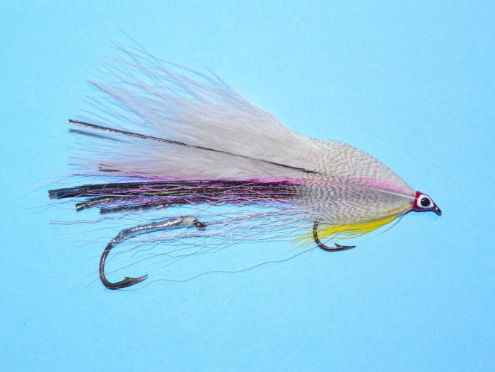 Feather fishing lure with purple and yellow accents, black hook and eye