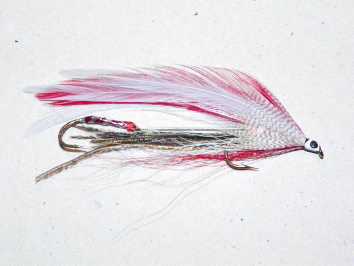Feather tandem fishing lure with red and white tail and metal hook