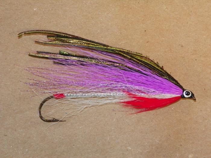 a #2 8XL streamer fly for fly fishing with a red tag and throat and white, lavendar, and peacock wings