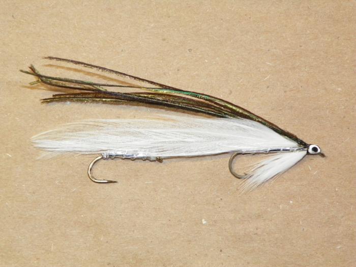 Fishing lure with white feather tail, shiny metal body, and double hook
