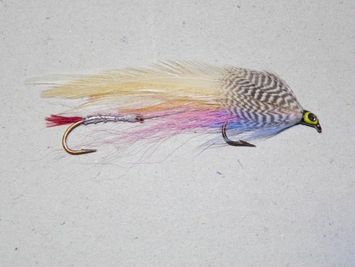 Feather fishing lure with multicolor body and eye, two metal hooks