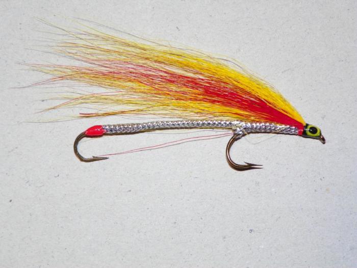 Multicolor tandem fishing lure with red-and-yellow body and silver head, double hooks
