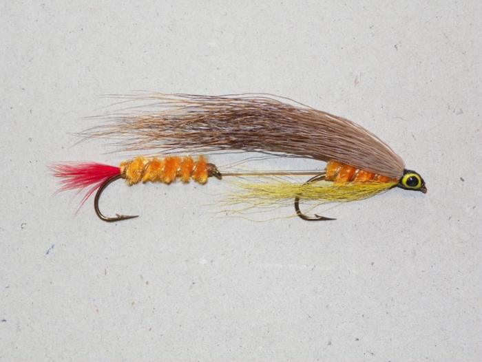 Fishing lure with brown body, yellow wing, and red tail, tandem hook