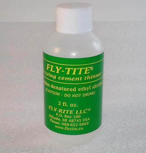 Fly-Tite cement thinner bottle with green label
