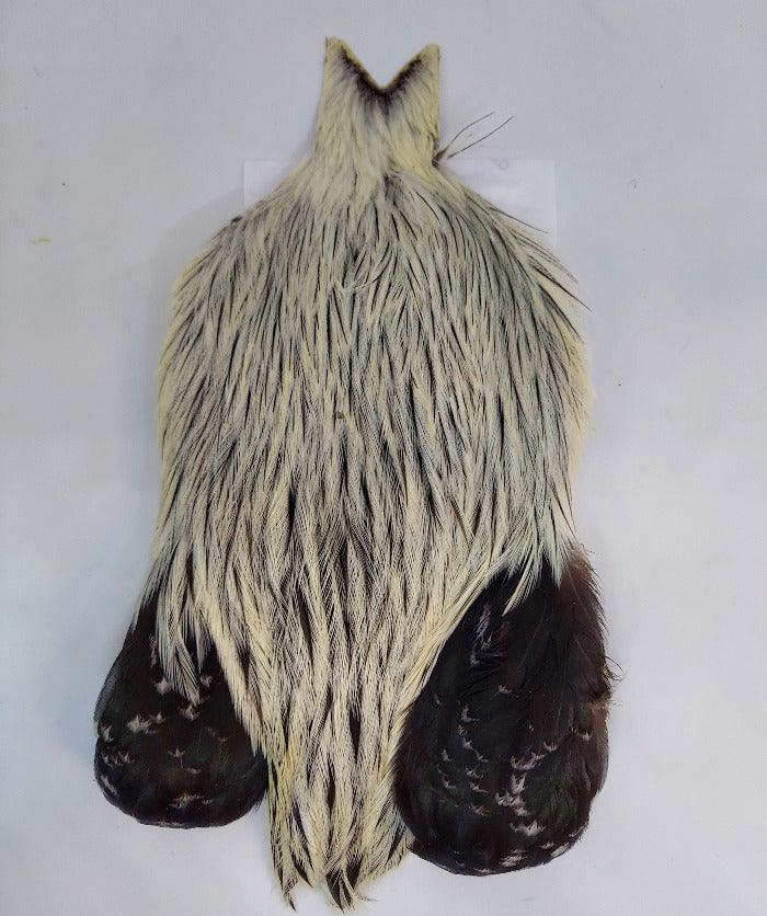 Streamer cape with cream-gray fur body and dark paw-like cuffs