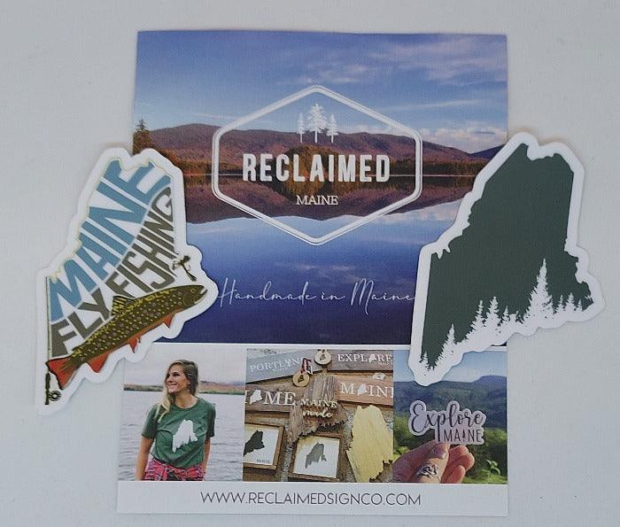A collage of Reclaimed Maine stickers and flyer