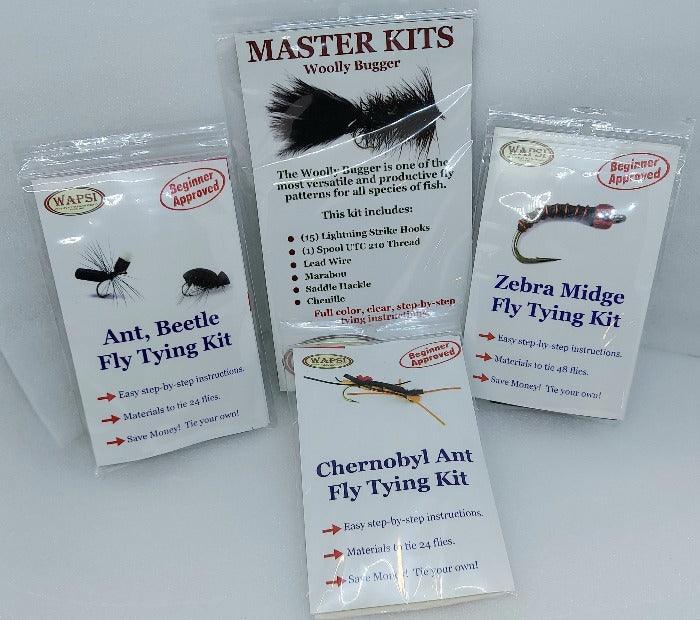 Fly tying kit boxes for individual flies, including Zebra Midge and Chernobyl Ant