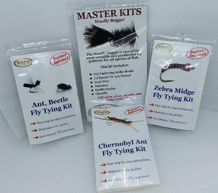 four packages of materials used for tying different types of flies