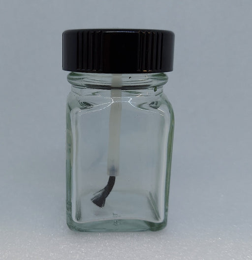 Clear 1 ounce empty jar with black plastic lid with attached brush