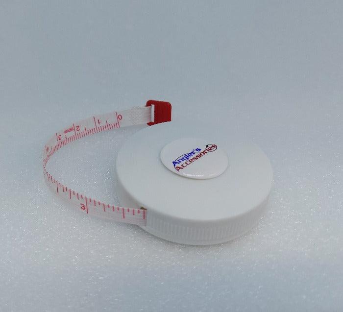 Retractable cloth measuring tape with red measurement markings, white case.