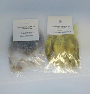 Two small packages of mallard flank feathers, one natural, and one dyed mayfly yellow