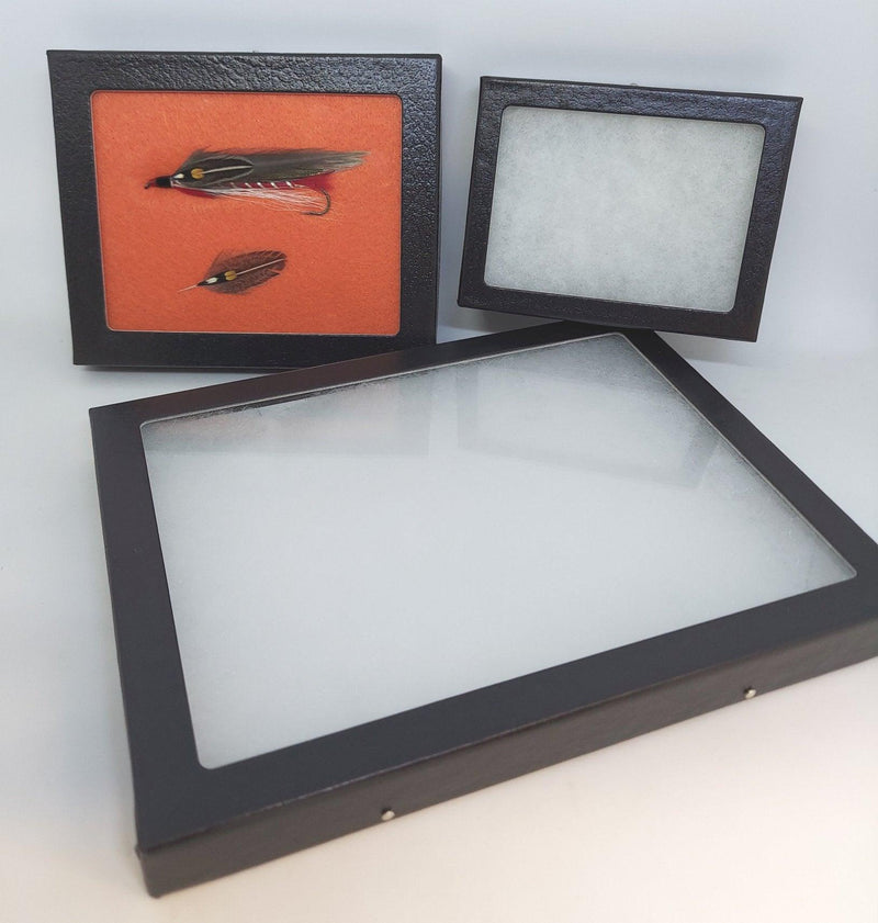 Display box set with dark frames and clear window fronts, three-piece view