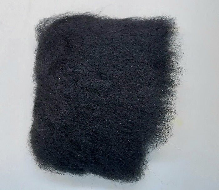 Black wool tuft with dense shag fibers