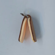 Brown fly dryer with metal ring top and two hanging leather legs