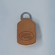Brown leather-style fly dryer with metal keyring and oval logo patch