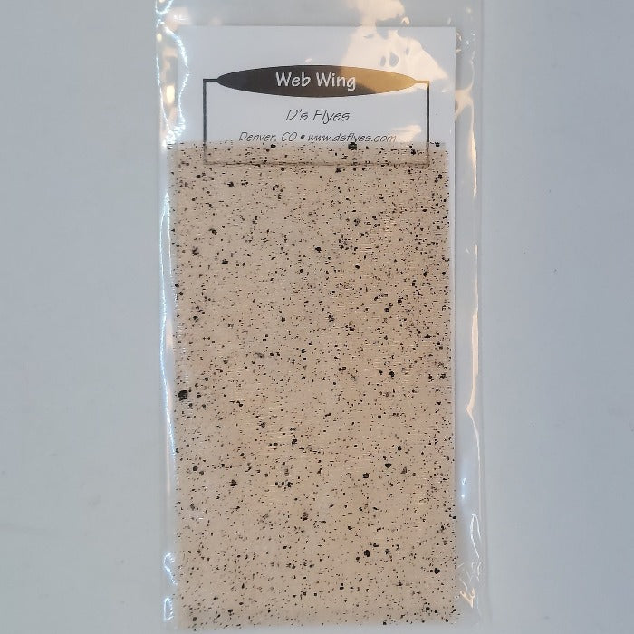 Mottled tan web wing sheet in a plastic sleeve