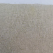 Tan web wing sheet with fine mesh texture, close-up in a sleeve