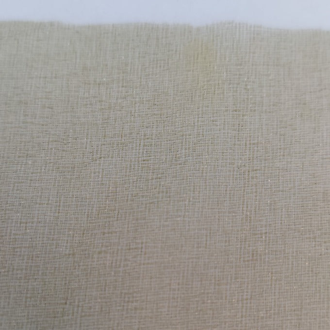 Tan web wing sheet with fine mesh texture, close-up in a sleeve