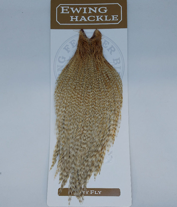 Barred ginger dry fly cape, dense brown-tan feather body with shaggy edges