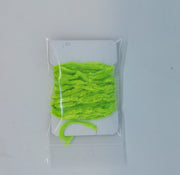 Chenille yarn bundle in vivid green, tightly looped in clear packaging